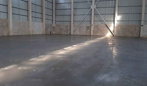 Damaged concrete industrial floor replaced and repaired through an overlay project